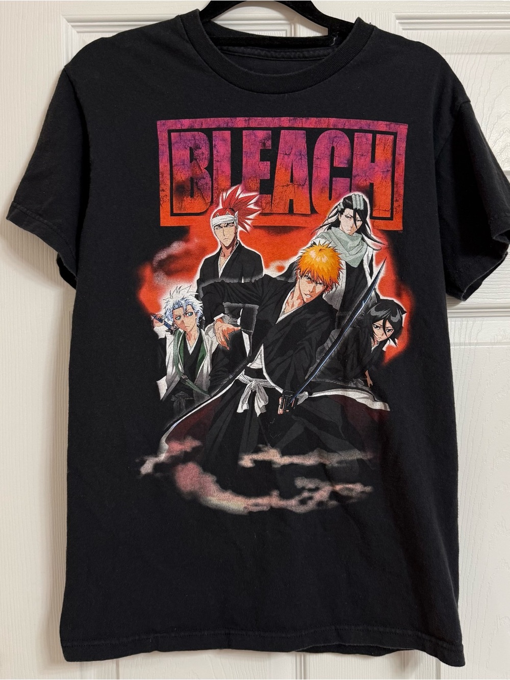 Ripple Junction Black Bleach Graphic Tee with Orange and Pink Logo